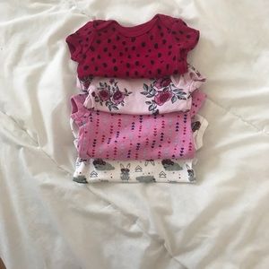 Four baby onesies